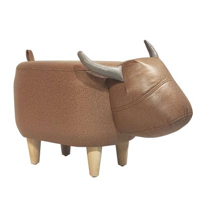 人氣牛凳子創(chuàng)意坐墩腳踏兒童坐凳可愛卡通家用頭層牛皮動(dòng)物換鞋凳